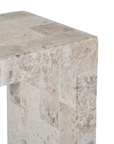 Duna Console Natural Fossil Stone close-up showing the tabletop edge, natural fossil markings and rectangular stone sections in soft beige tones.