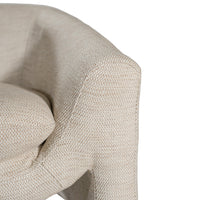 Azura Occasional Chair by Uniqwa Collections in Natural fabric, featuring soft curved lines, a deep seat cushion, and refined textured upholstery for a sculptural yet relaxed look