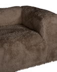Close up of the Harlow three seater sofa highlighting the plush chocolate faux fur seat cushion, rounded armrest and softly textured upholstery.