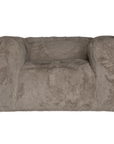 Harlow Sofa one seater upholstered in biscuit faux fur with a low profile silhouette, rounded arms and deep cushioned seating shown from the front.