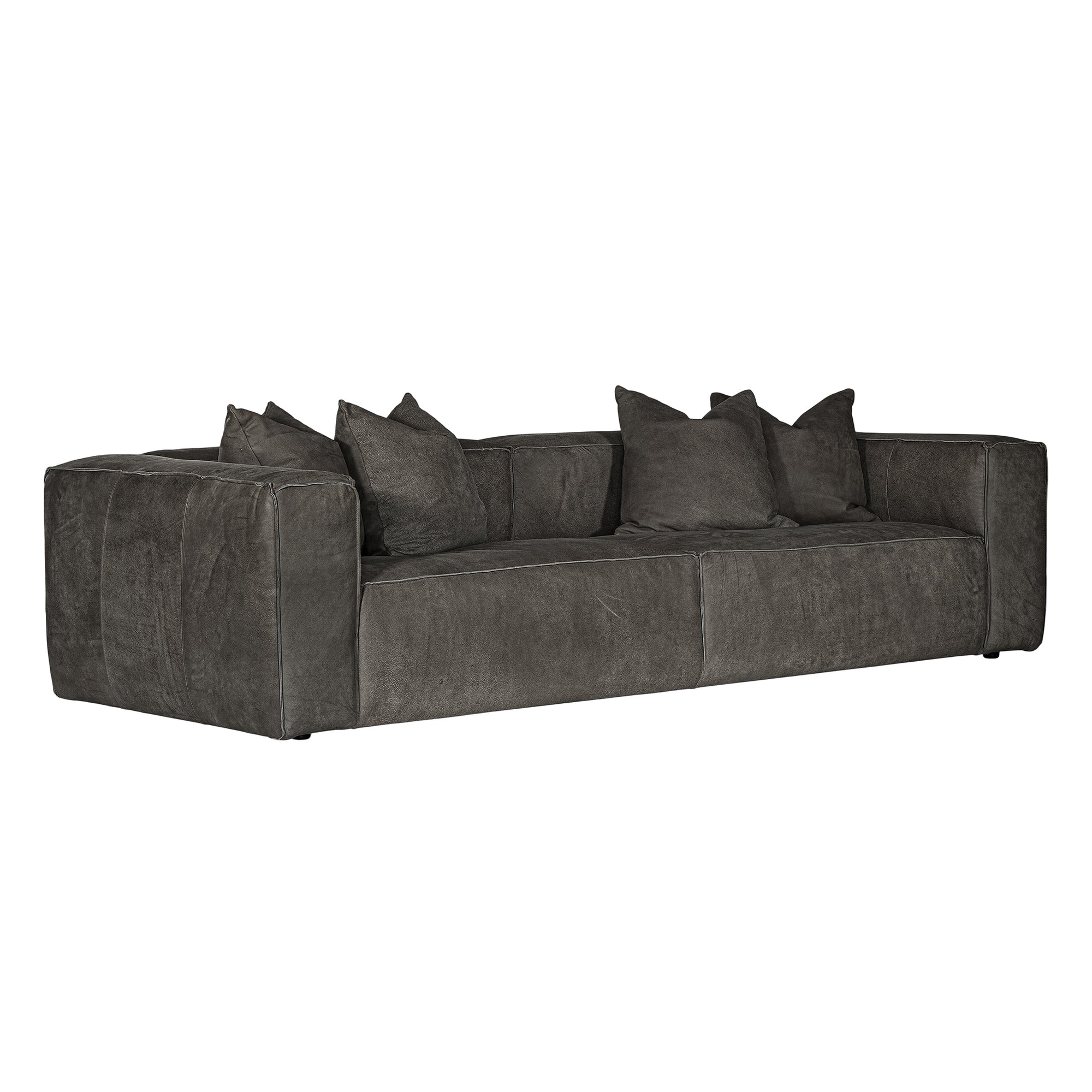 A modern four seater sofa upholstered in dark charcoal gray leather, featuring matching throw pillows, shown against a plain white background.