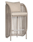 A modern outdoor barstool with a curved metal frame, beige rope-wrapped sides, and a light beige cushioned seat and backrest, shown on a plain white background.