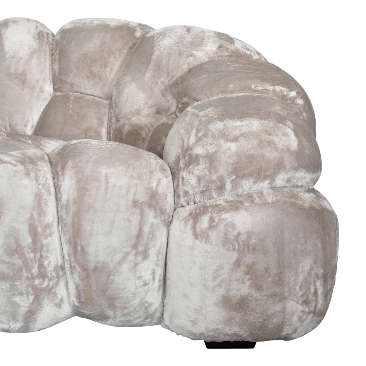 Melo Sofa Lush Pearl close-up showing the rounded armrest, plush polyester upholstery and distinctive padded panel construction.