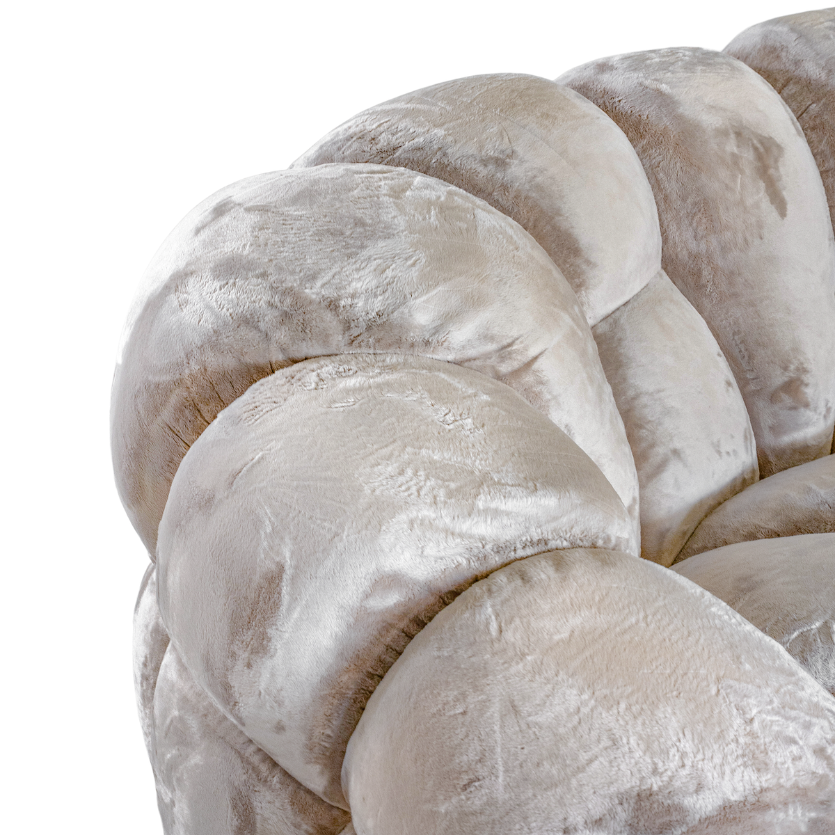 Melo Sofa Lush Pearl close-up highlighting the curved upper armrest, segmented back cushions and soft, light-reflecting upholstery.