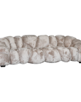 Melo Sofa Lush Pearl three seater angled view, showing its deep seating, sculptural segmented upholstery and rounded armrests.