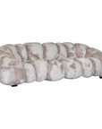 Melo Sofa Lush Pearl three seater angled view, showing its deep seating, sculptural segmented upholstery and rounded armrests.