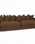 A brown slipcovered sofa with a skirted base, wide armrests, and a row of matching back cushions, shown on a plain white background.