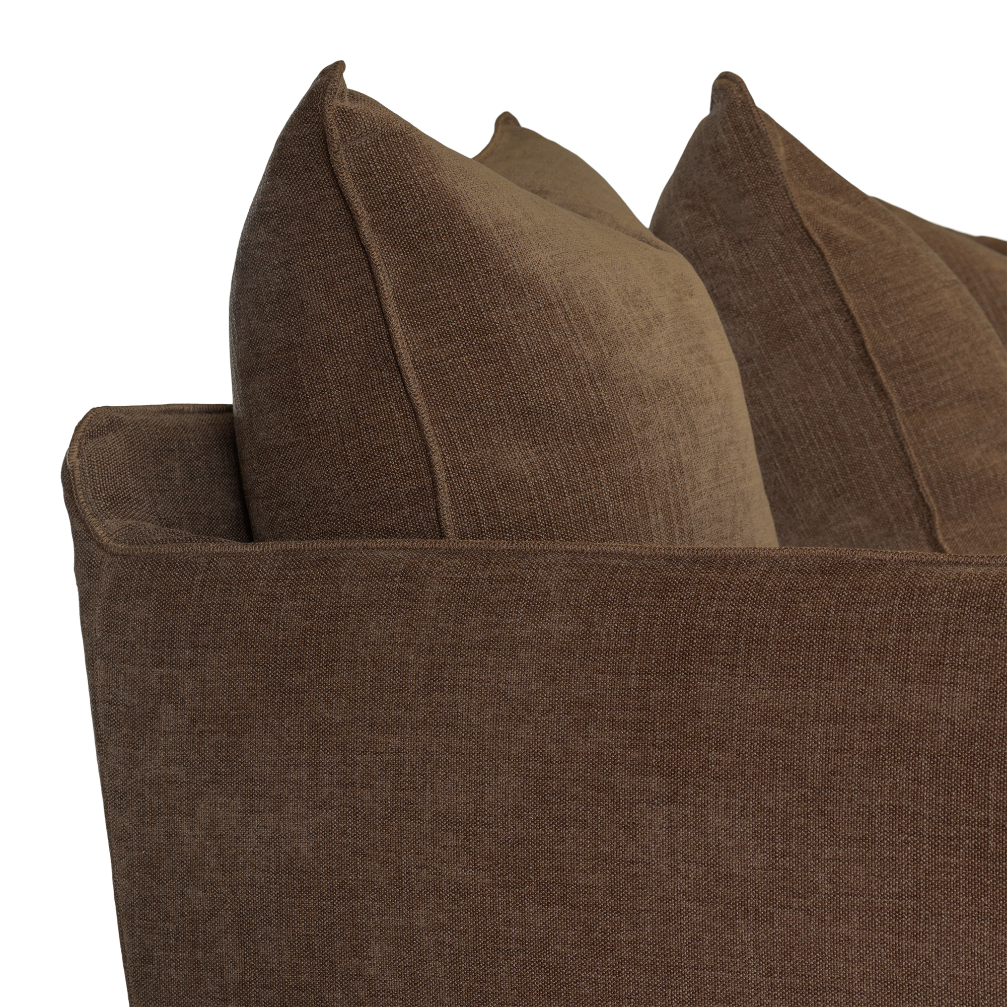 Close-up of a brown upholstered sofa arm with matching brown throw pillows against a white background.