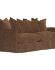 A brown slipcovered sofa with multiple matching throw pillows, shown on a plain white background.