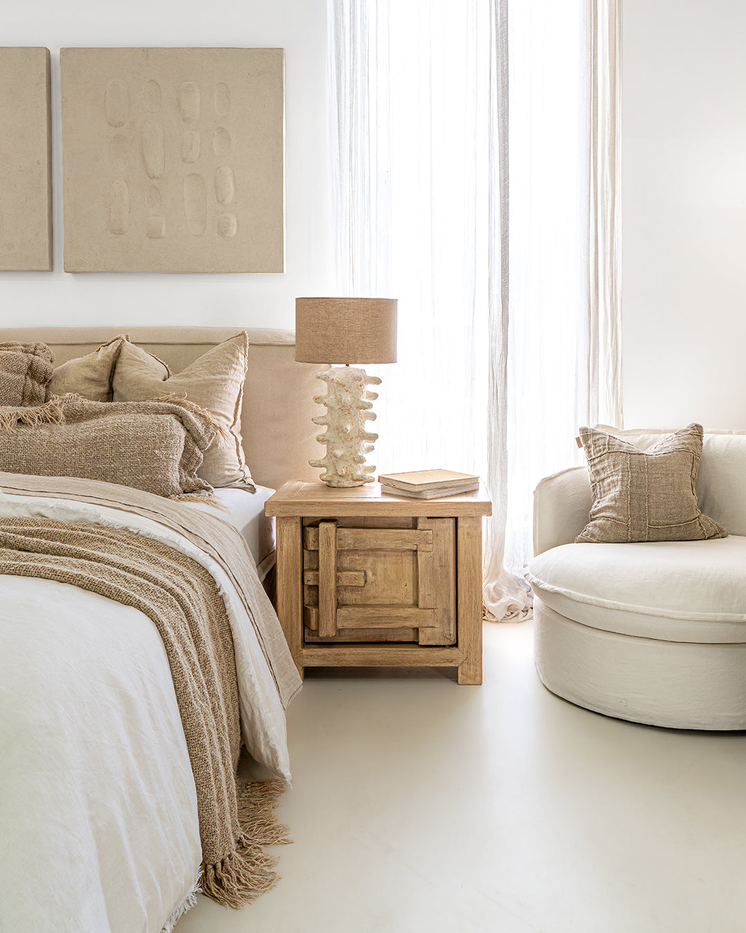 Bulu Bedside handcrafted from reclaimed pine styled with a coral-inspired lamp in a modern neutral bedroom setting