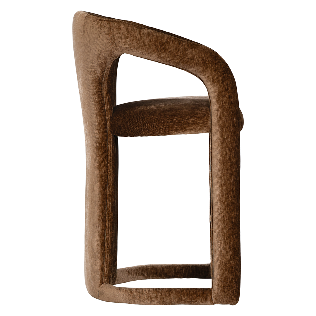 Fikile barchair in bronze with a curved upholstered frame, rounded backrest and integrated footrest detail.