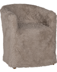 Hamilton Dining Chair upholstered in biscuit faux fur with a curved wraparound backrest, fully upholstered silhouette and plush seat shown from an angled front view.