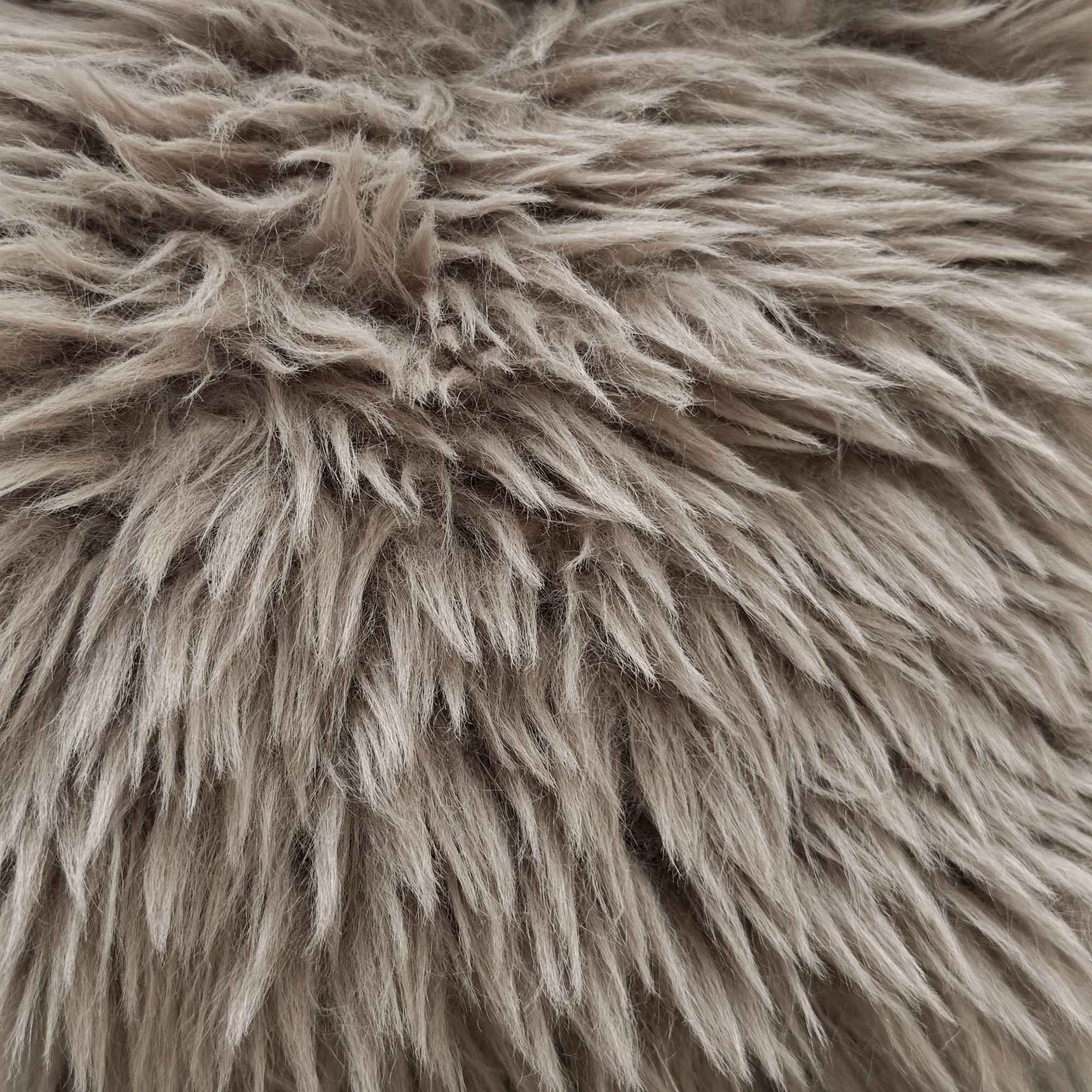Close up of the Hamilton Dining Chair biscuit faux fur upholstery highlighting the long pile texture and soft tactile finish.