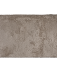 Side profile of the Harlow Sofa upholstered in biscuit faux fur, highlighting the fully upholstered silhouette and soft textured finish.