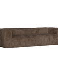 Angled view of the Harlow three seater sofa upholstered in chocolate faux fur featuring rounded arms, deep cushioned seating and a contemporary low profile design.