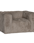 Harlow Sofa one seater upholstered in biscuit faux fur with a low profile silhouette, rounded arms and deep cushioned seating shown from an angled front view.
