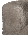 Close up detail of the Harlow Sofa one seater highlighting the rounded backrest and biscuit faux fur upholstery with a soft, tactile textured finish.