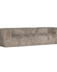 Harlow Sofa three seater upholstered in biscuit faux fur with a low profile silhouette, curved arms and deep cushioned seating shown from an angled front view.
