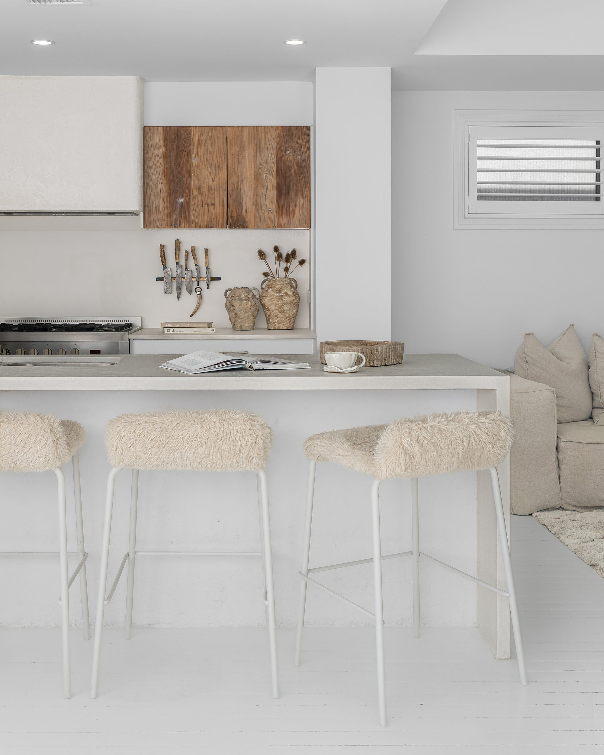 Hotham Barchairs with Ukoko Vases and the Mayi Bowl styled together in a light, neutral kitchen interior.
