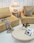 Bedu Side Table positioned beside the Maui Sofa with the Sabi Table Lamp beneath a pair of Senah Pendants.