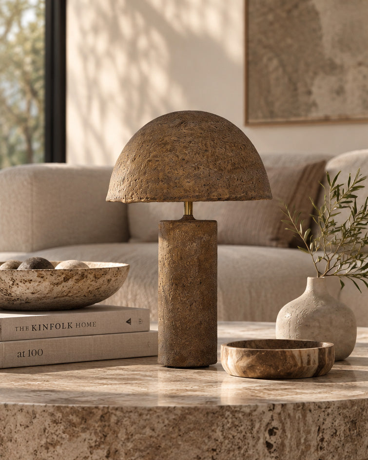 Samrah Table Lamp Dark Roast Large with sculptural dome shade and textured finish, styled on a stone coffee table in a neutral living room.
