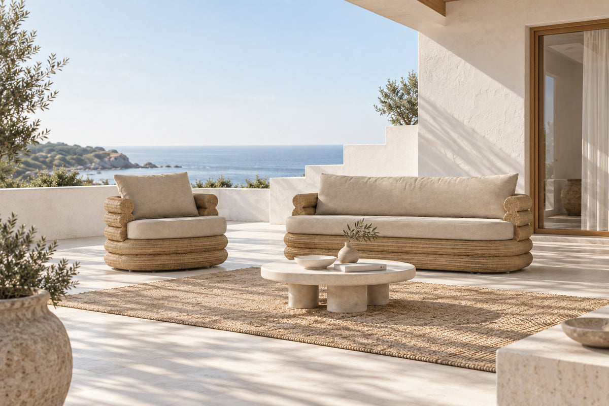 Satori Swivel Chair and Satori Sofa with natural woven frames and neutral cushions in a coastal outdoor living setting.
