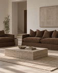 KULALA Living Singita Sofa in Cocoa shown as a three seater sofa and one seater in a warm neutral living room.
