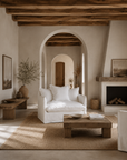 Singita Sofa One Seater in White styled in a spacious Mediterranean inspired living room with warm timber beams, arched architecture and natural textures.