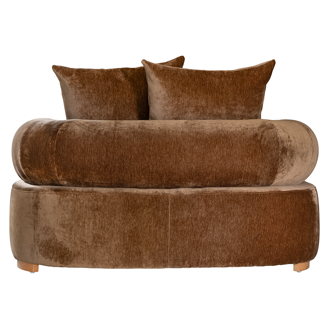 Soneva  one seater sofa in bronze fabric featuring a soft curved silhouette with round bolster cushions and plush back pillows.