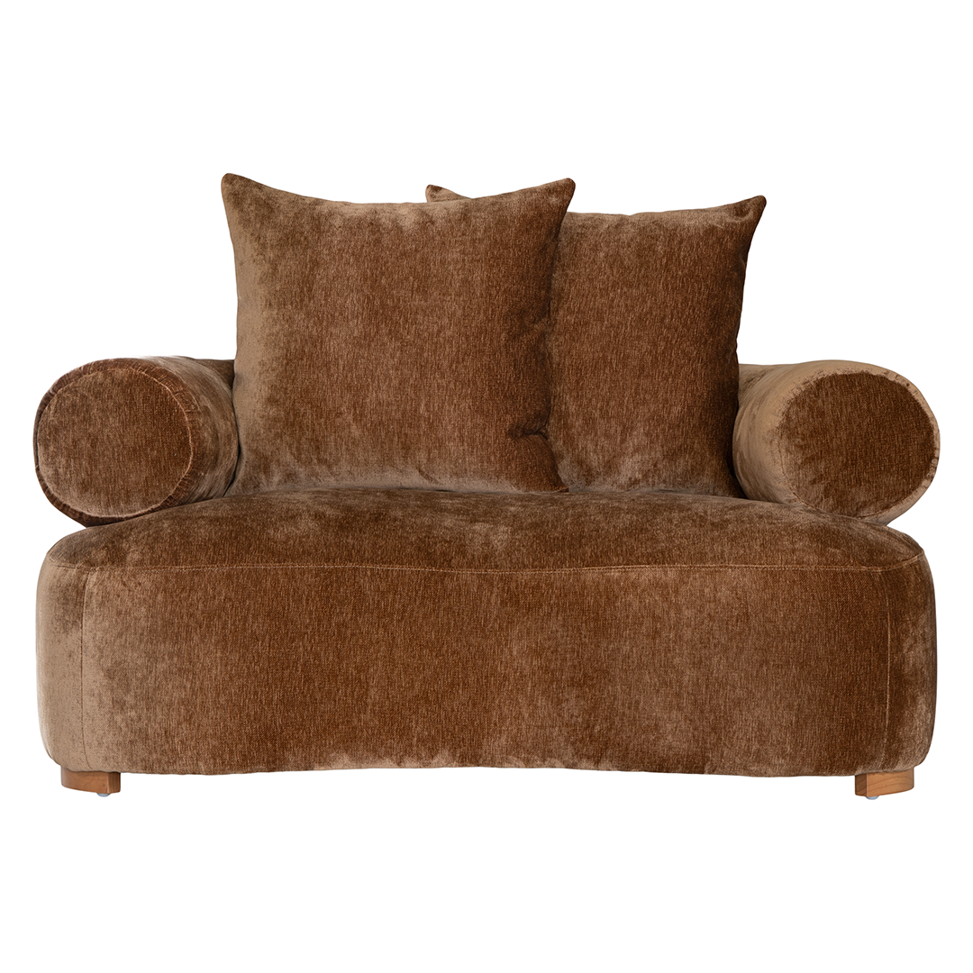 Soneva  one seater sofa in bronze fabric featuring a soft curved silhouette with round bolster cushions and plush back pillows.