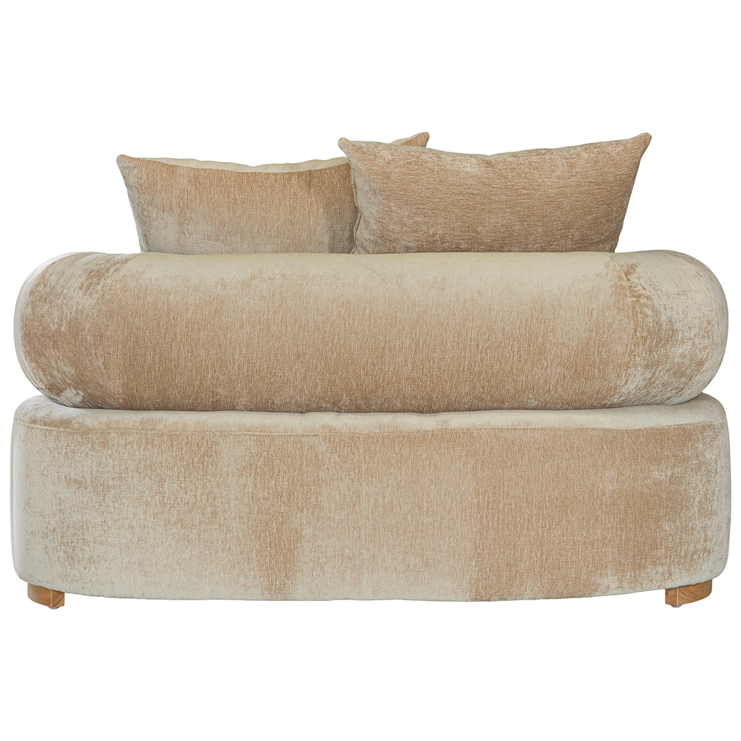 Soneva one seater sofa in dolce fabric featuring a soft curved silhouette with round bolster cushions and plush back pillows.