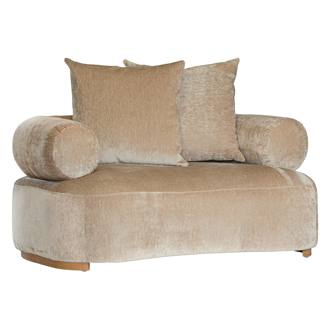 Soneva one seater sofa in dolce fabric featuring a soft curved silhouette with round bolster cushions and plush back pillows.