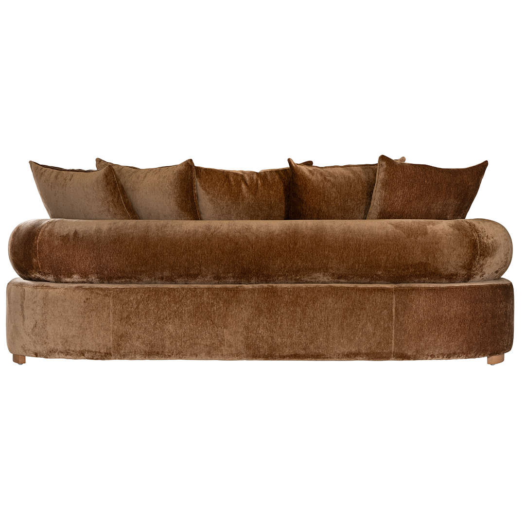 Soneva three seater sofa in bronze fabric featuring a soft curved silhouette with round bolster cushions and plush back pillows.