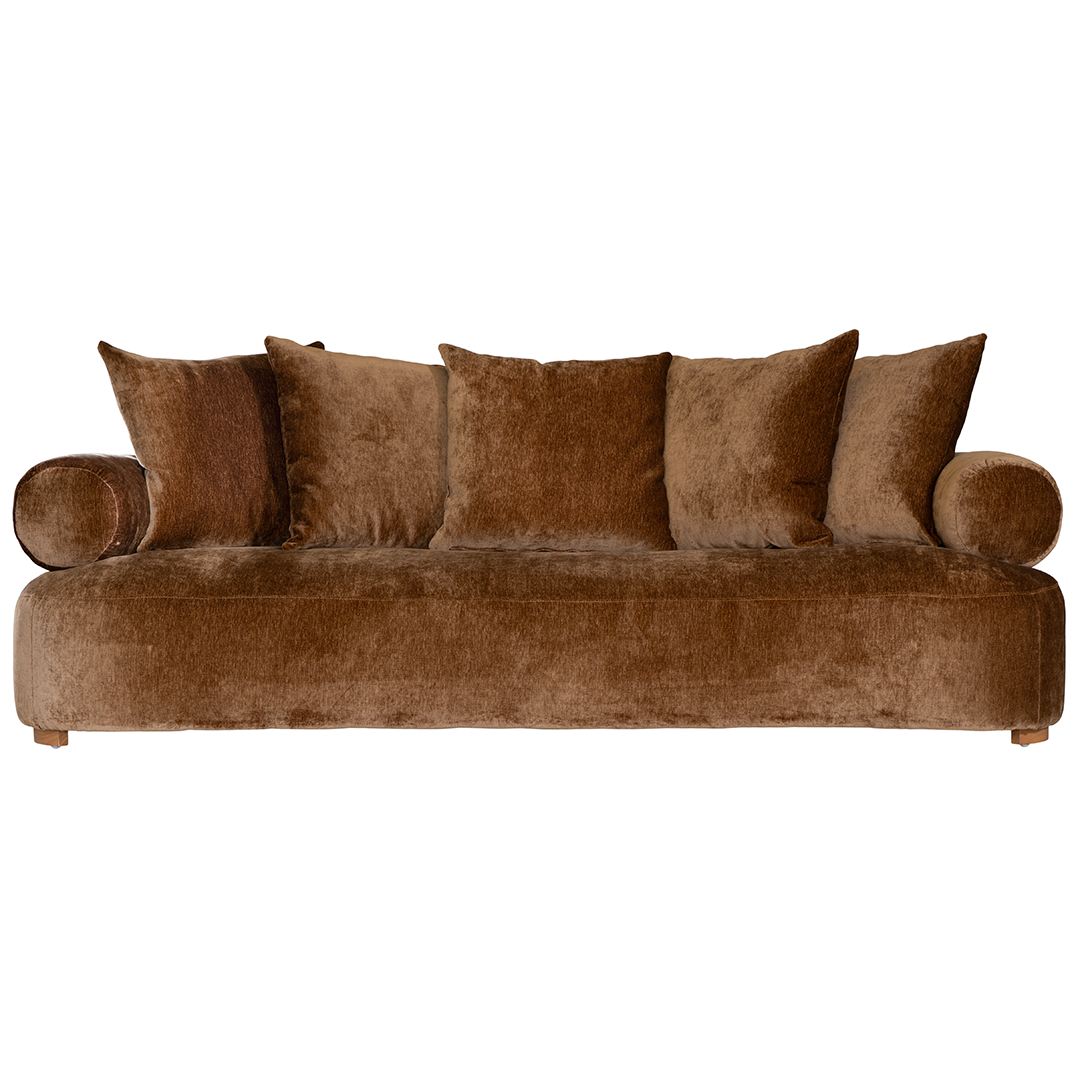 Soneva three seater sofa in bronze fabric featuring a soft curved silhouette with round bolster cushions and plush back pillows.