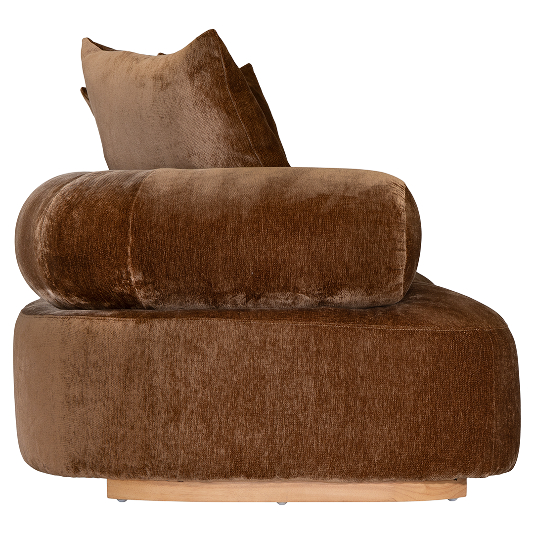 Soneva three seater sofa in bronze fabric featuring a soft curved silhouette with round bolster cushions and plush back pillows.