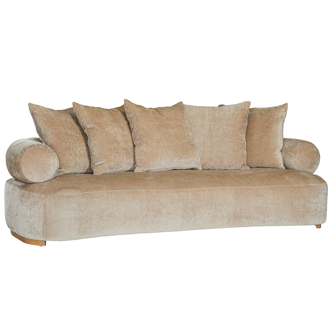 Soneva three seater sofa in dolce fabric featuring a soft curved silhouette with round bolster cushions and plush back pillows.