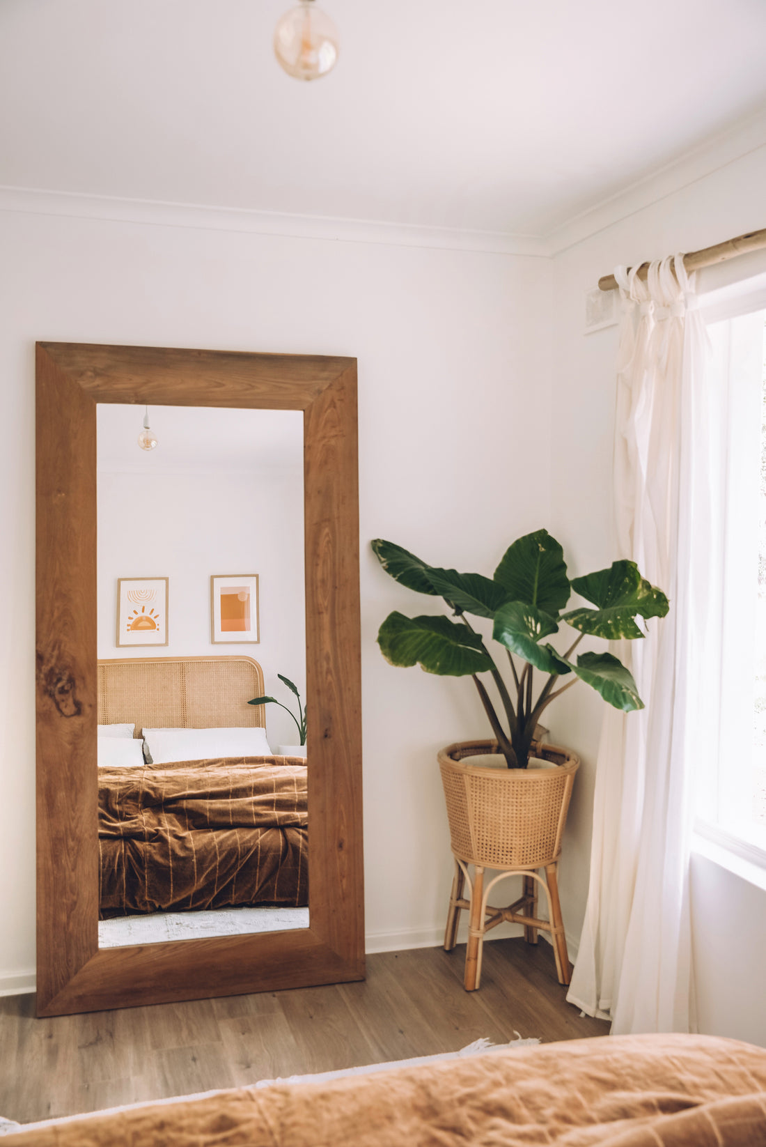 Uniqwa Collections Nature Weathered Mirror styled in a coastal living room with neutral tones, rattan accents, and natural textures.