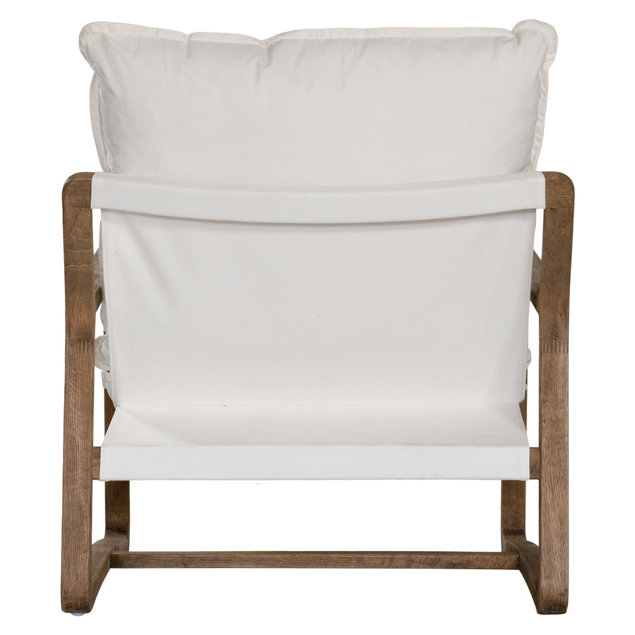 Barbuda Occasional Chair by Uniqwa Collections featuring white cushions and a curved driftwood frame in a relaxed resort-style silhouette.