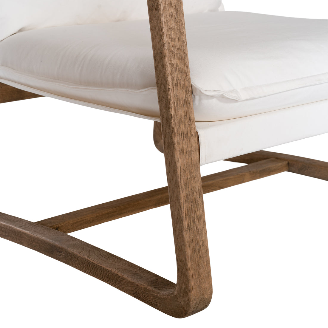Barbuda Occasional Chair by Uniqwa Collections featuring white cushions and a curved driftwood frame in a relaxed resort-style silhouette.