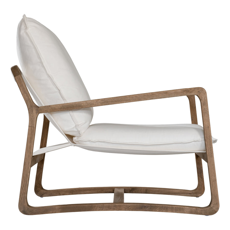 Barbuda Occasional Chair by Uniqwa Collections featuring white cushions and a curved driftwood frame in a relaxed resort-style silhouette.